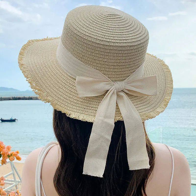 Korean-Inspired Wide-Brim Straw Hat with Bow Detail